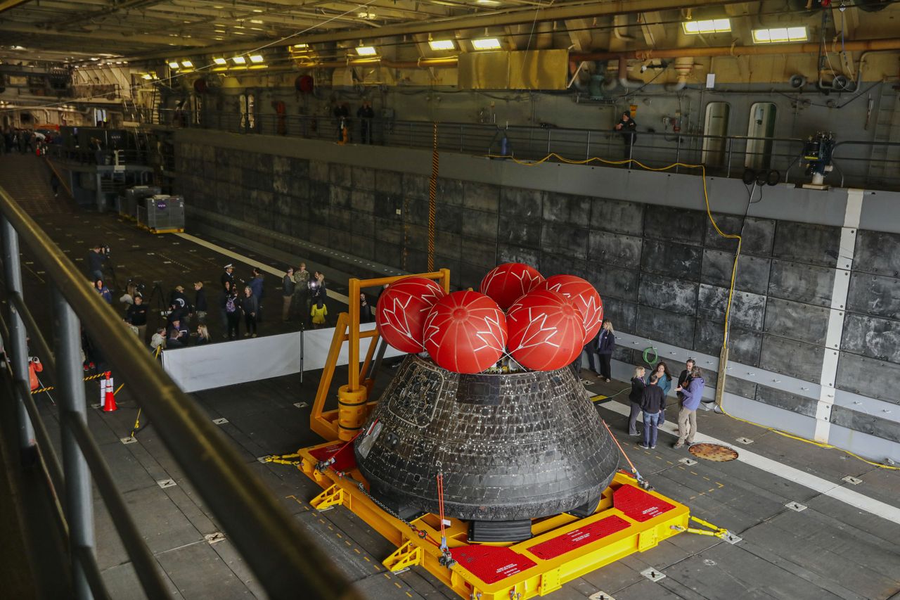 Pictures of the Orion spacecraft being treated after arriving in port in San Diego on Dec. 13, 2022.