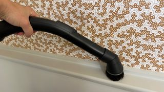 Cleaning baseboards with Miele Blizzard CX1 canister vacuum