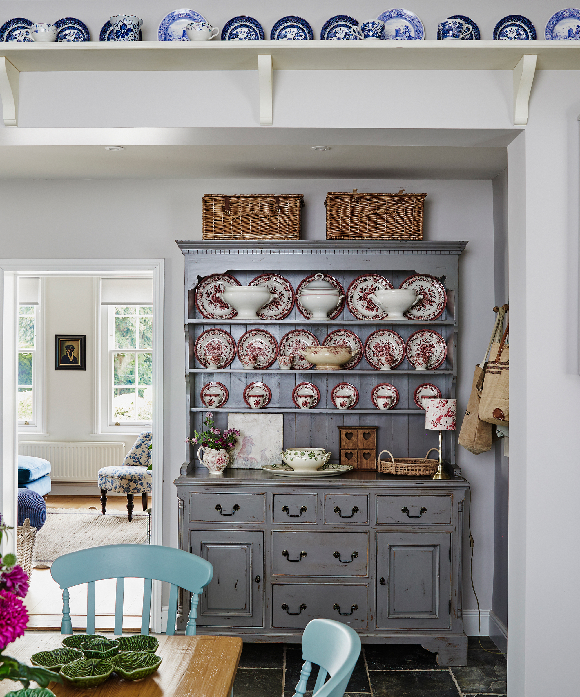 Grey painted country style dresser with vintage china in a country kitchen