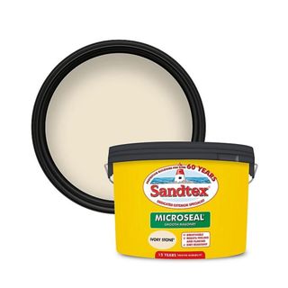 Yellow pot of Sandtex paint with product information on the front and a circle of paint to showcase the colour behind it