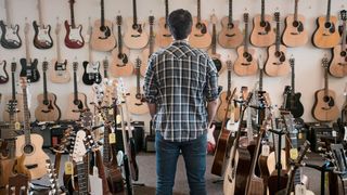 Man in guitar shop