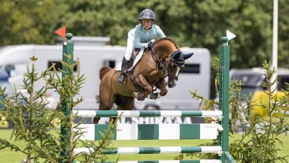 Anya Dewey Clarke jumping in the winter 128cm final