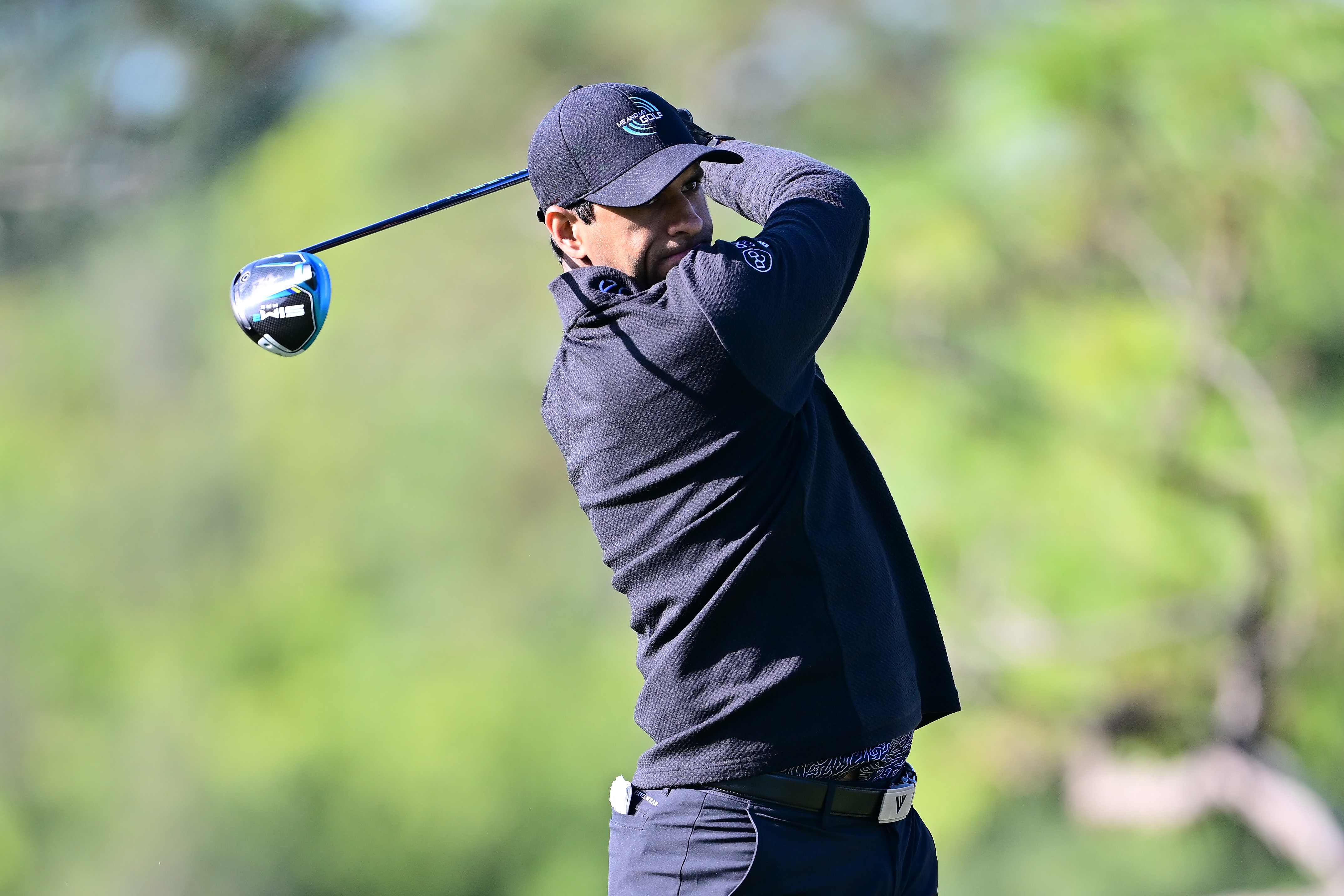 Aaron Rai hits a driver