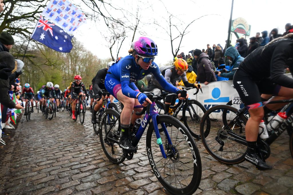 WEVELGEM BELGIUM MARCH 26 21competes passing through a Kemmelberg cobblestones sector during the 12th GentWevelgem In Flanders Fields 2023 Womens Elite a 1625km one day race from Ypres to Wevelgem UCIWWT on March 26 2023 in Wevelgem Belgium Photo by Luc ClaessenGetty Images