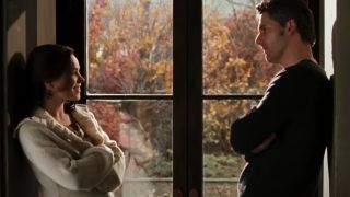 Rachel McAdams and Eric Bana talk while standing in front of a window in The Time Traveller's Wife.