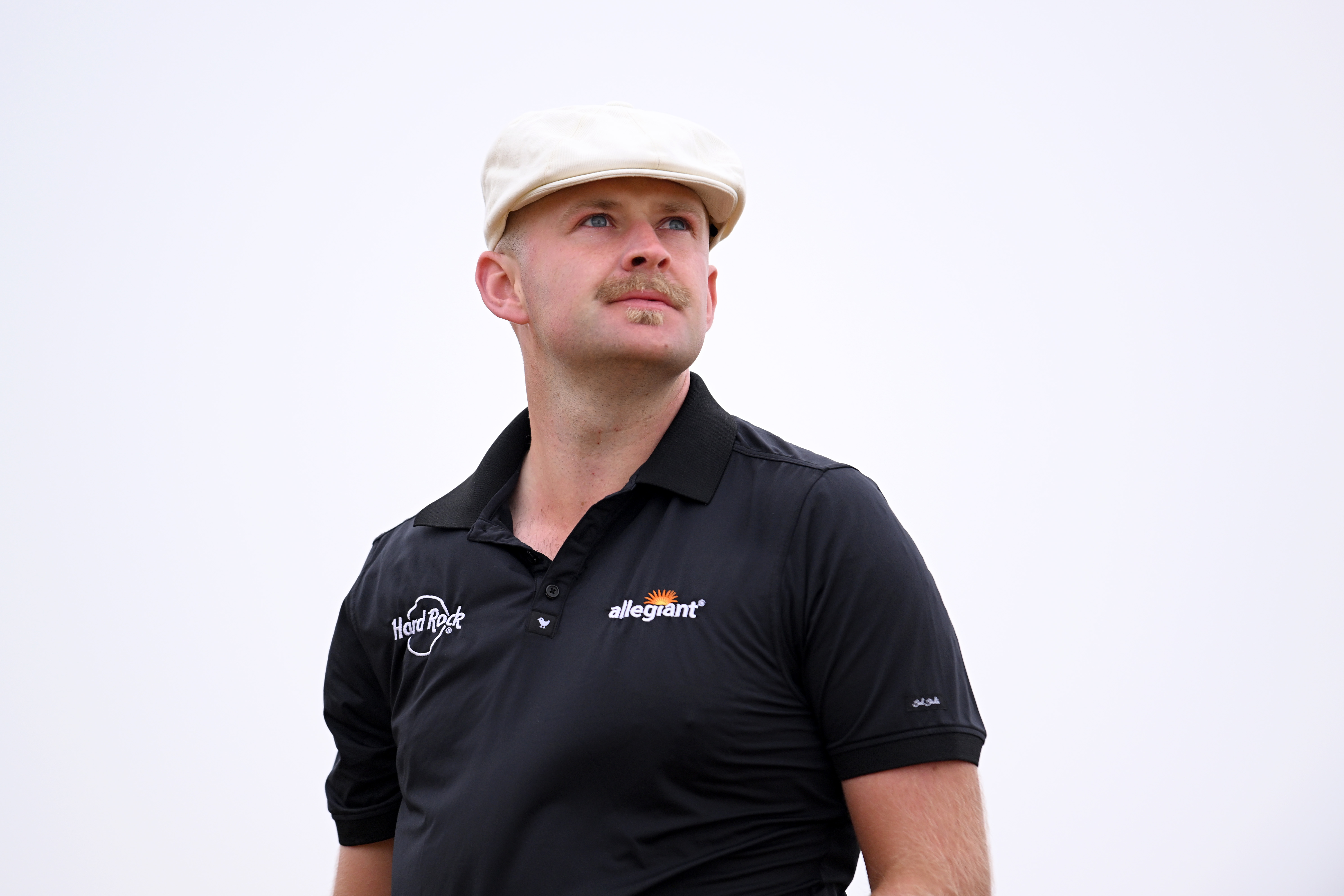 Harry Hall watches a tee shot at Open Championship Final Qualifying
