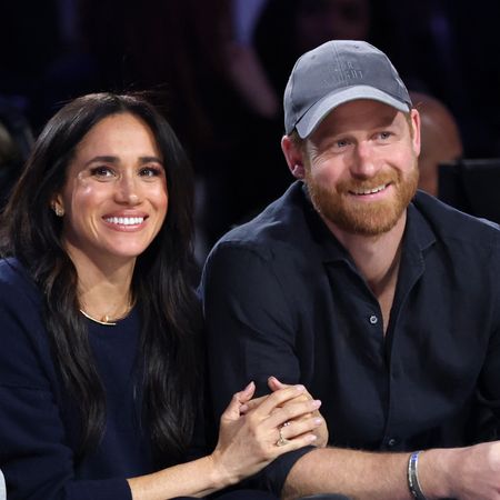 Meghan Markle linking arms with Prince Harry