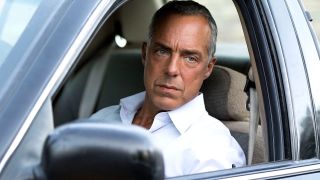 Titus Welliver as Harry Bosch sitting in a car