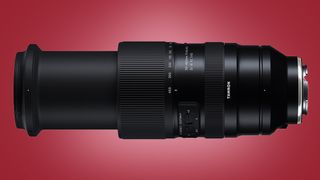 The Tamron 50-400mm F/4.5-6.3 Di III VC VXD lens on a red background