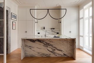 A kitchen with marble countertop