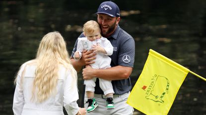 Jon Rahm, his wife, Kelley, and their son, Kepa at the 2022 Masters Par-3 Contest at Augusta National