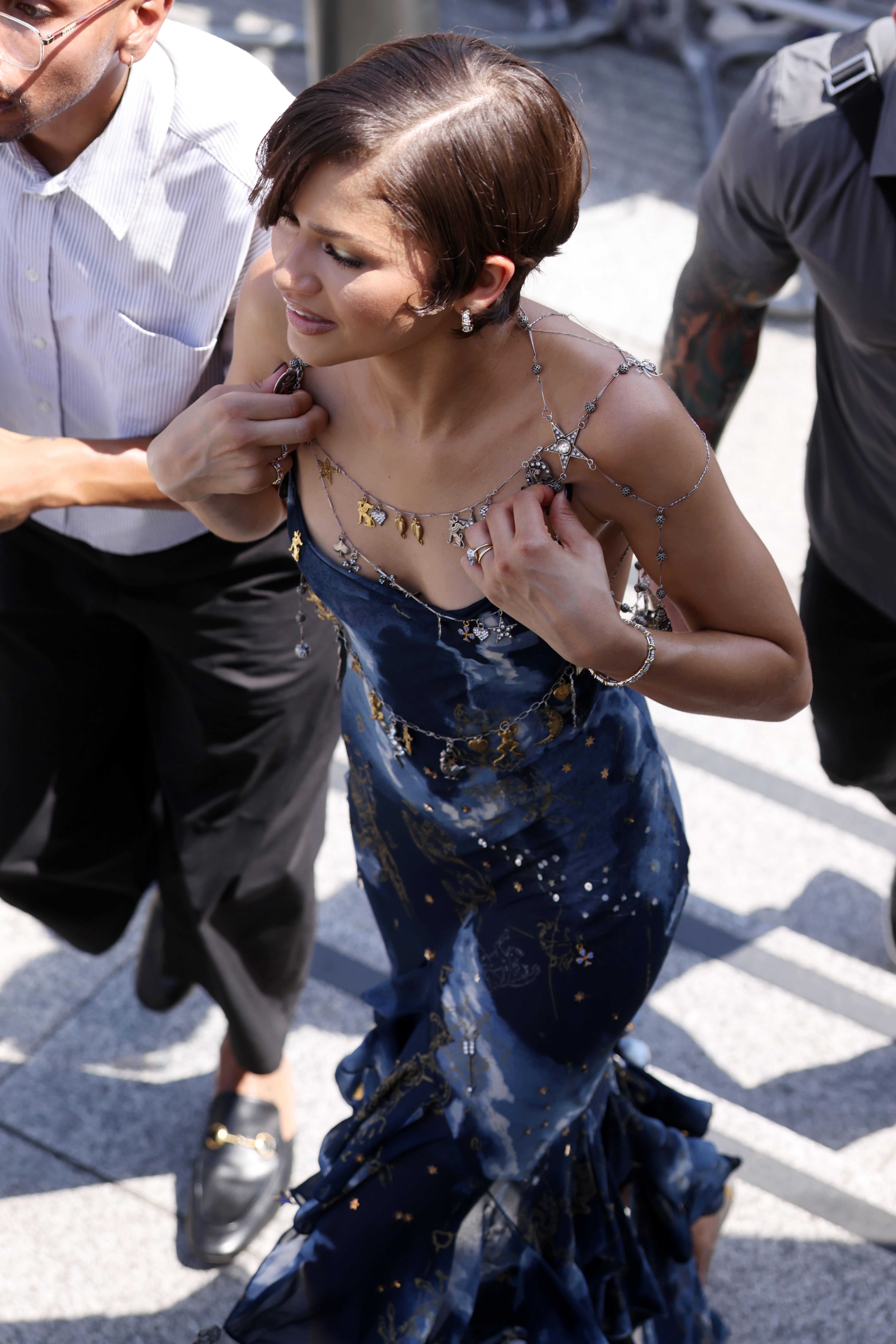Zendaya wore a vintage John Galliano backless dress with a spiderweb-shaped chain necklace