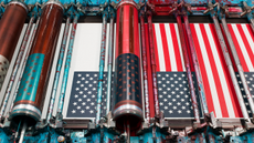 New York art exhibitions. American flags in production on a rotary screen printer, 2018. Photographed by Christopher Payne (American, born 1968). Annin Flagmakers (South Boston, Virginia). Courtesy of the artist