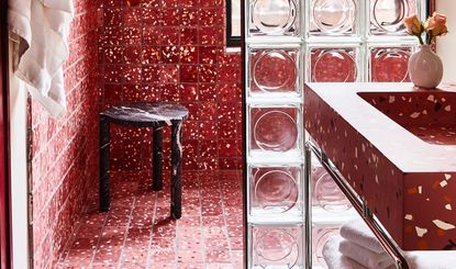 a red terrazzo bathroom 