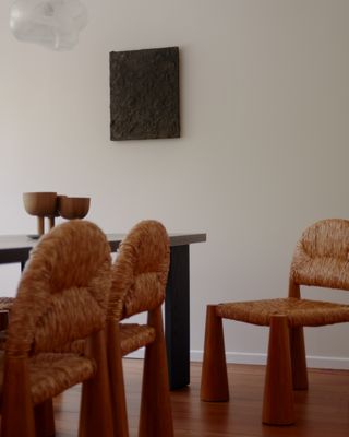 A dining room with fabric dining chairs