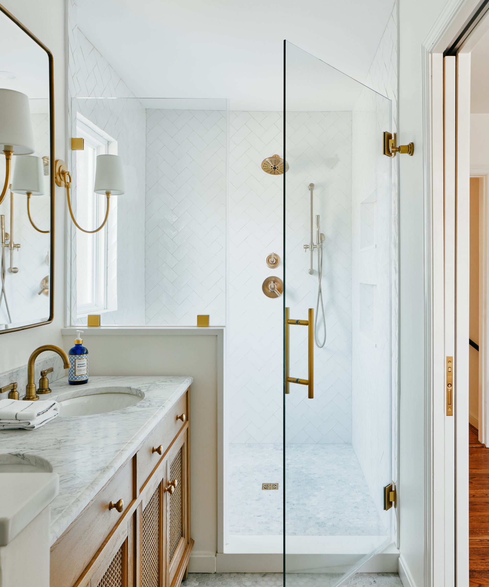 A neutral bathroom with a window within the shower enclosure