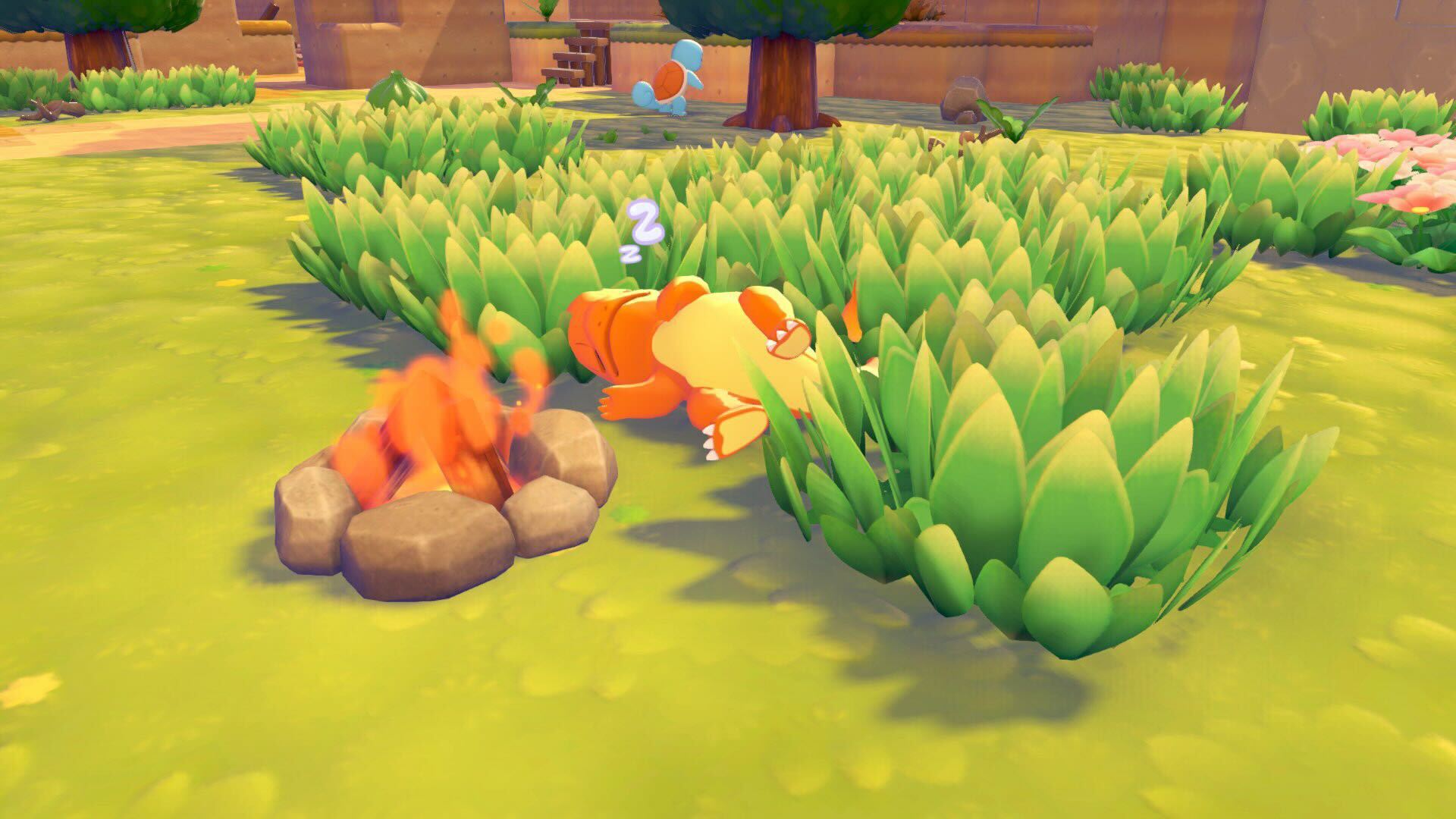 Charmander sleeping by a campfire in Pokemon Pokopia