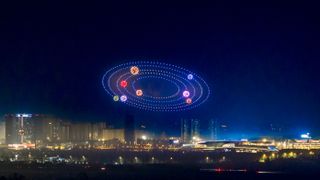 About 1,000 drones form the pattern of solar system in the sky during a light show at Chengdu Science Fiction Museum to welcome the Chinese Lunar New Year on February 7, 2024 in Chengdu, Sichuan Province of China.