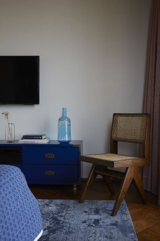 A bedroom with a TV in it