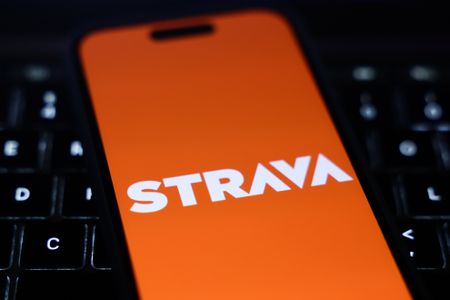 A phone with the Strava app on it 