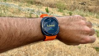 The Samsung Galaxy Watch Ultra showing a post-run summary of distance, pace, time, and other stats.