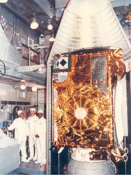 Engineers pose with India's INSAT-1A weather and communications satellite ahead of its April 10, 1982.