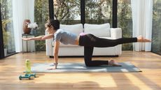 Woman exercising on an exercise mat at home