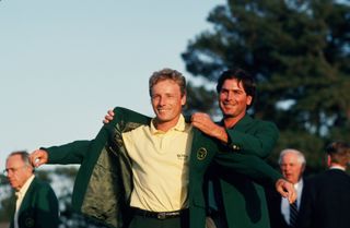 Bernhard Langer receiving the green jacket from Fred Couples at the 1995 Masters