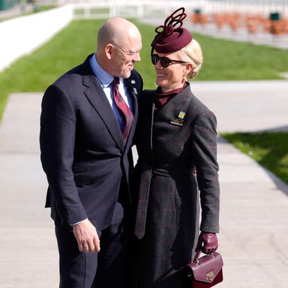 Zara and Mike Tindall with their arms around each other at Cheltenham 2026 races