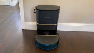 Philips HomeRun 7000 Series Aqua Vacuum and Mop Robot in its base station