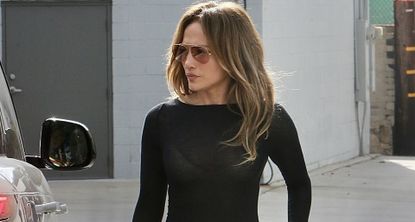 Jennifer Lopez walks to her car wearing a pair of naked shoes and a black birkin bag