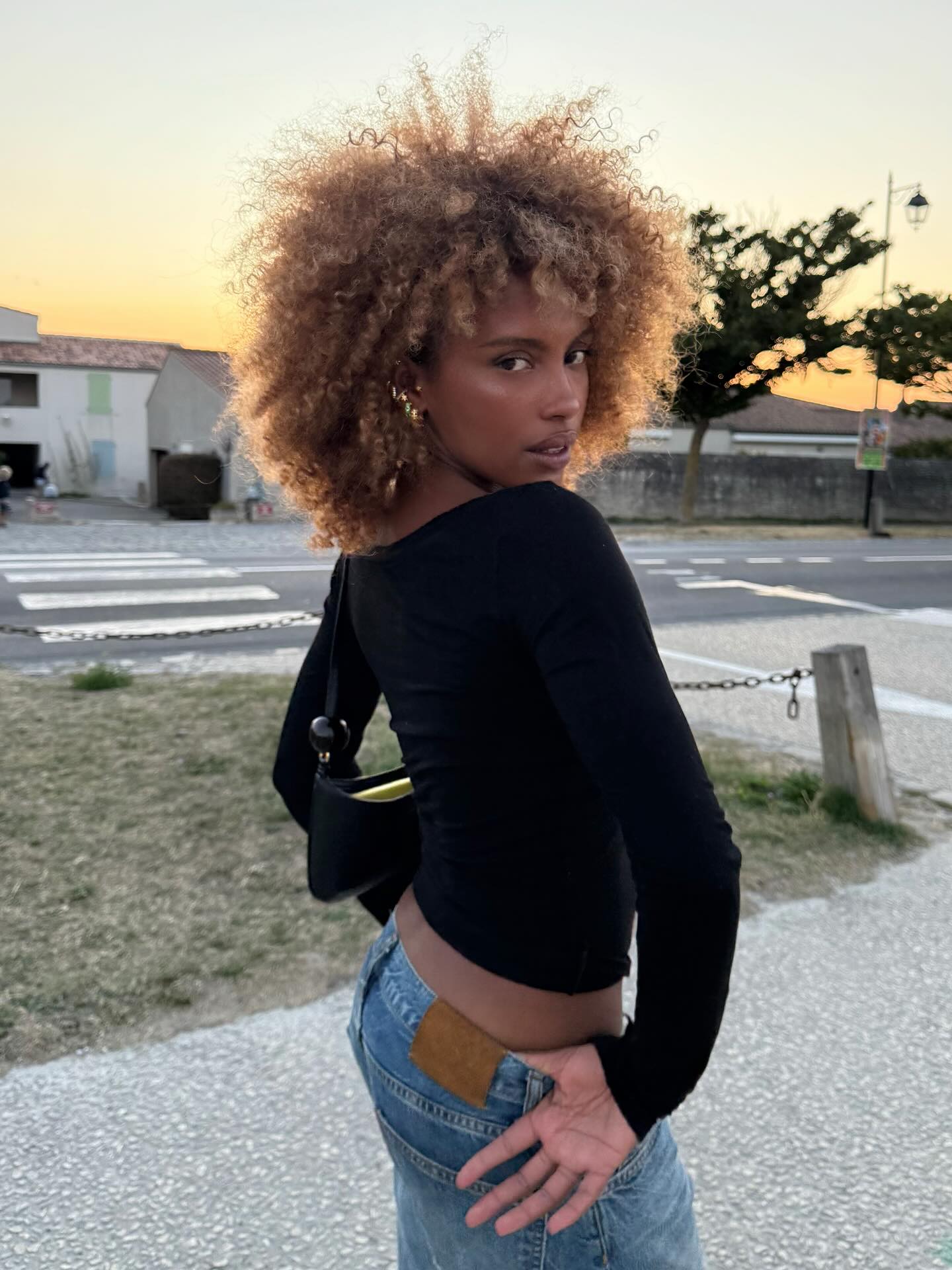 MV Tiangue with brown hair and blonde highlights