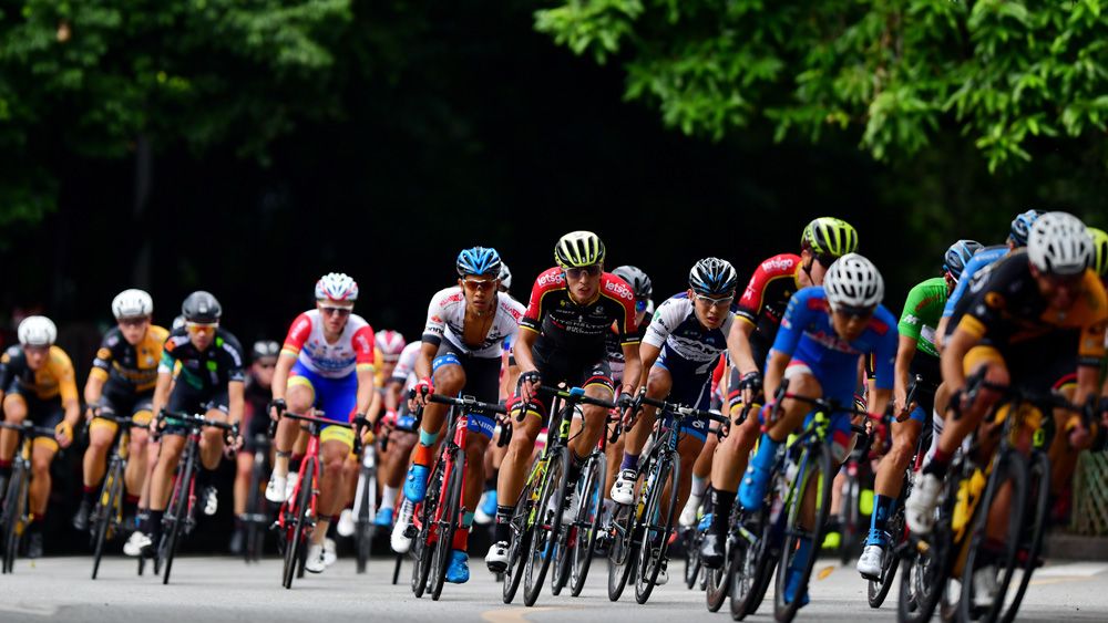 The Tour of Fuzhou riders emerge from the shadows