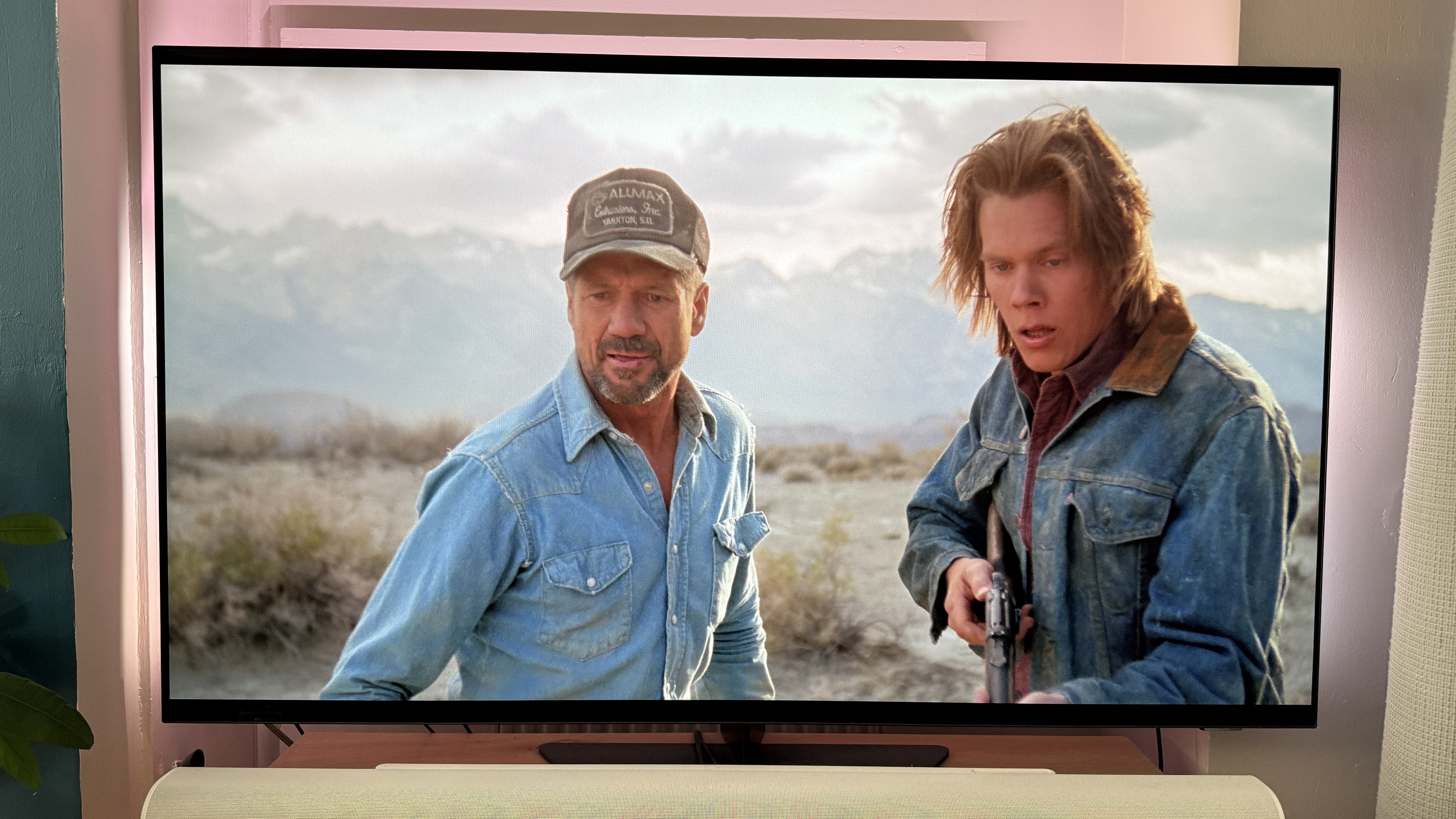 Earl and Valentine in Tremors look scared at something off screen