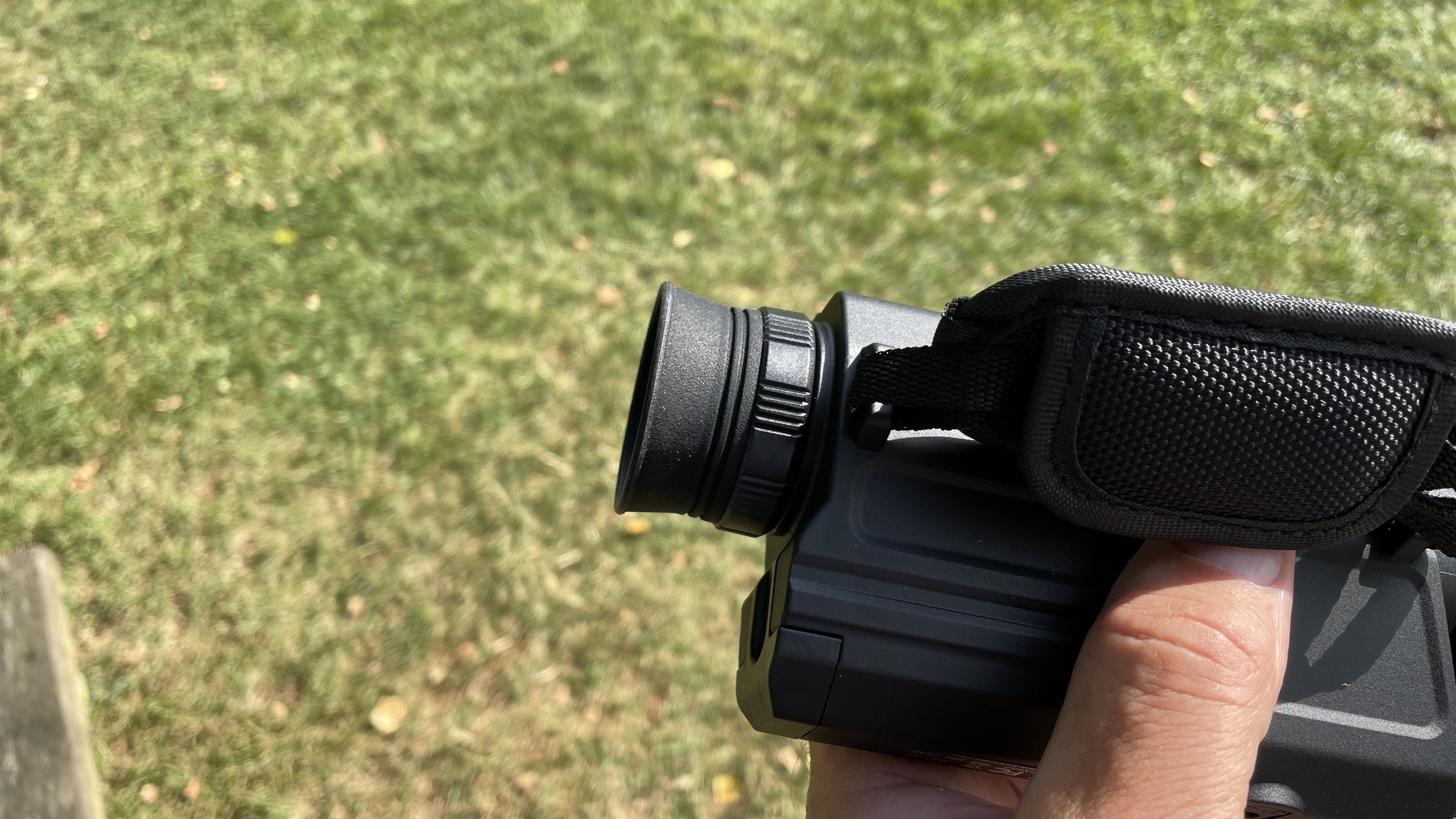 A side-on view of the Bushnell Equinox X650 Digital Night Vision monocular, showing the diopter.