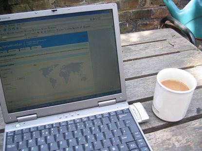 Laptop Showing Landscape Design Next To Coffee Cup