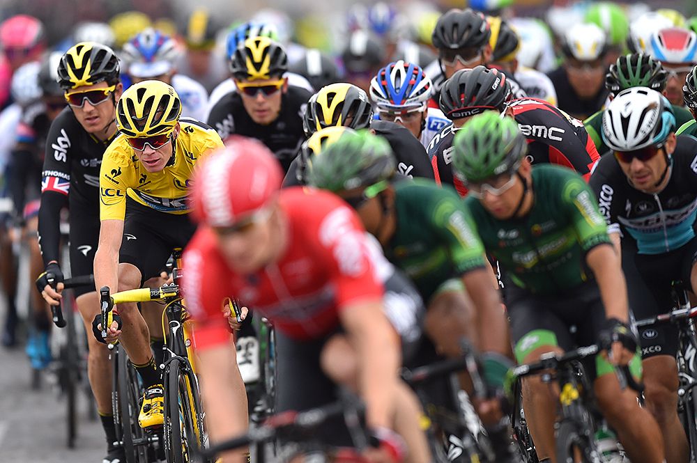 Yellow jersey Chris Froome (Team Sky) sits in the field