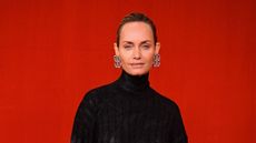 amber valletta on a red background