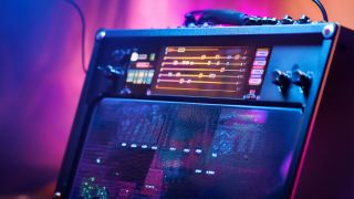 A screen on a futuristic guitar amplifier showing guitar tablature