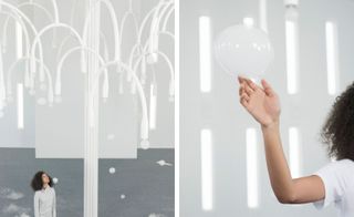 Woman reaching out to touch bubbles