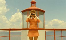 Moonrise Kingdom still showing a woman holding binoculars
