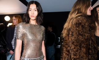 Model wears a gold chainmail T-shirt