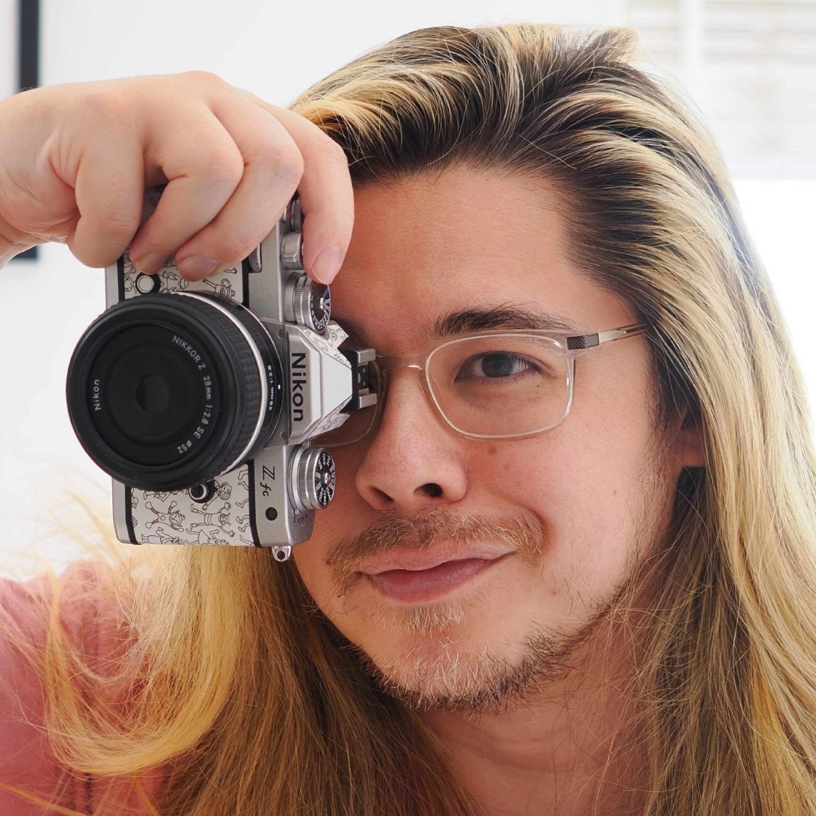 James Artaius holding a Nikon Z fc, one of the best cameras for beginners