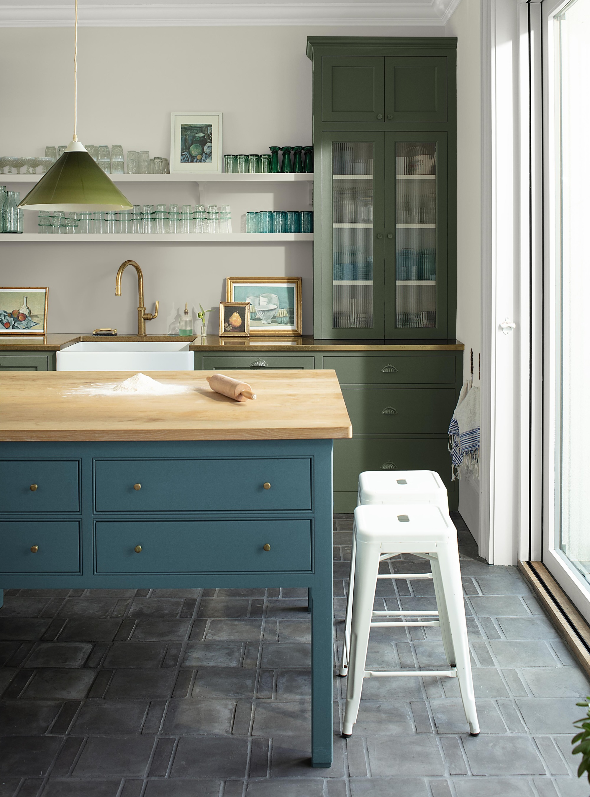 Teal and moss green kitchen with grey floor