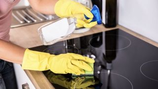 Induction countertop being cleaned