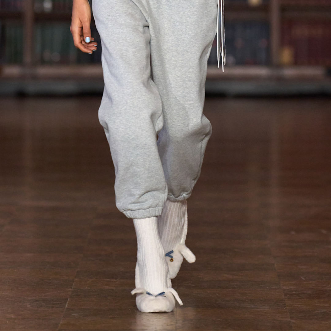 a model wearing bunny slipper heels on the sandy liang fall 2026 fashion show runway
