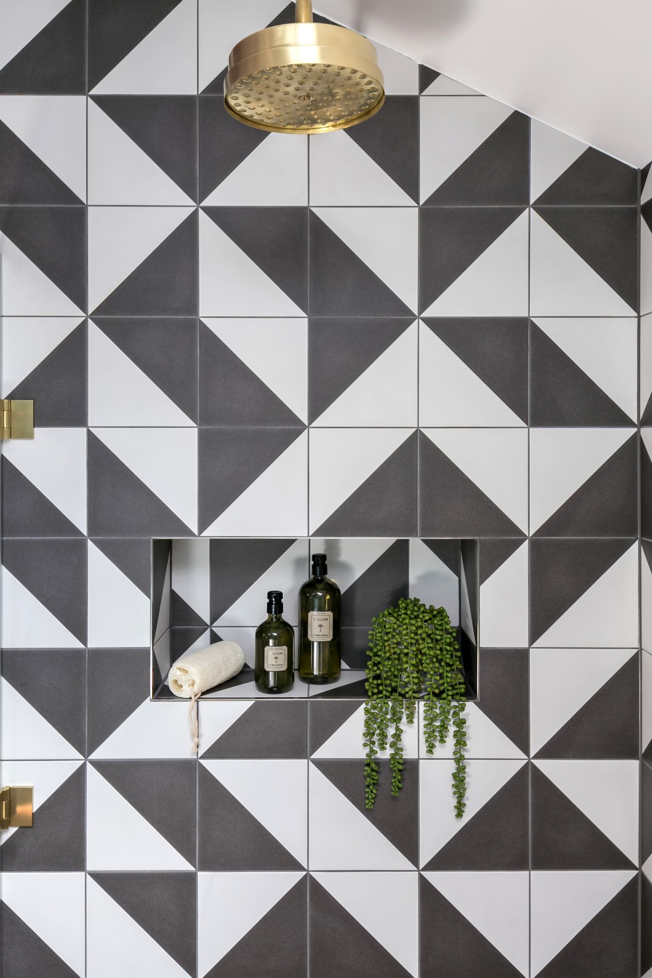 Black and white shower with built-in shelf
