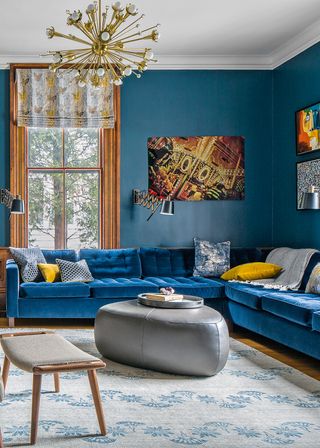 Luxurious blue living room with yellow cushions