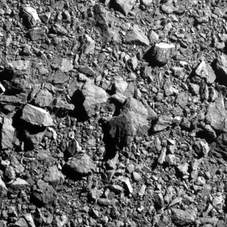 a dense pile of rocks seen in black and white