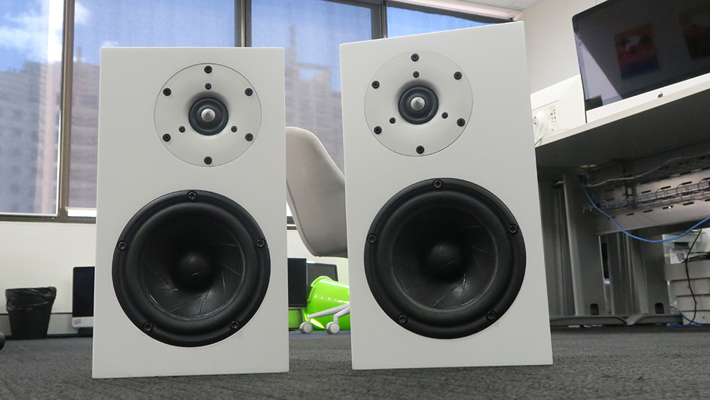 A pair of white Serhan Swift mµ2 Mk II on grey carpet
